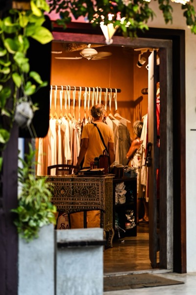 Shoppers browsing the racks in a boutique